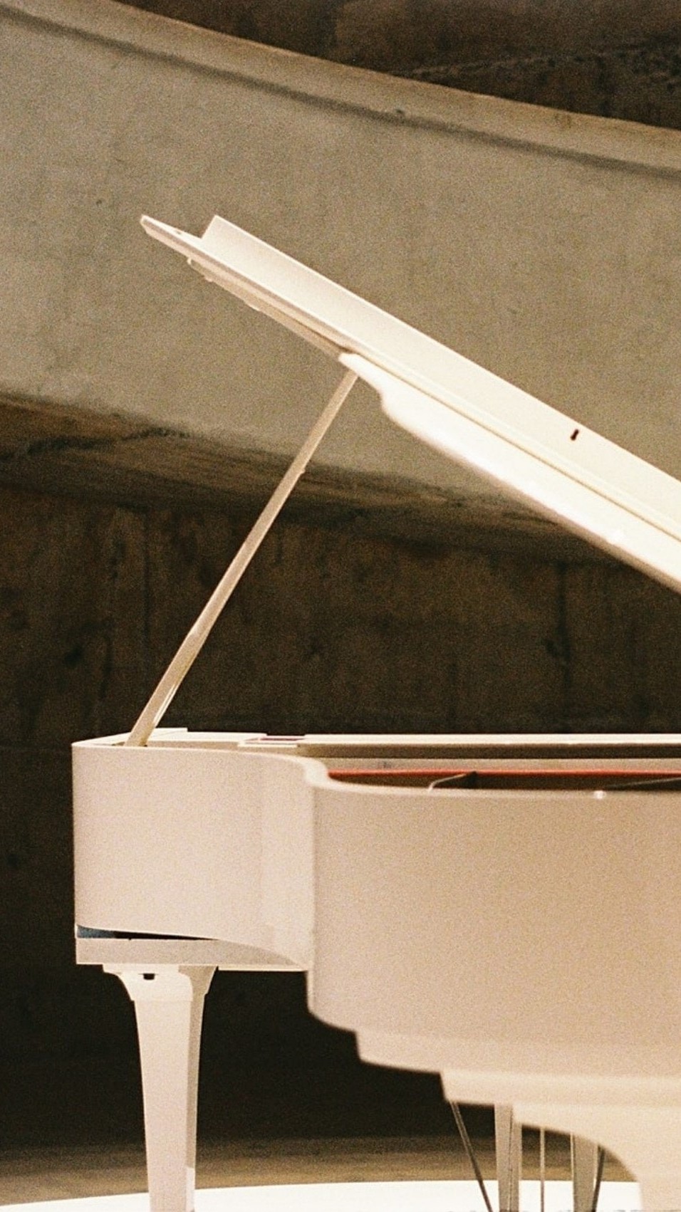 photo of white piano, select photo to learn more about Elton's work with soundtracks